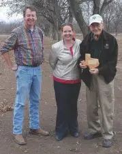 LeRoy Olsak holds his state championship plaque from the 2013 crop's Texas State Pecan Show.