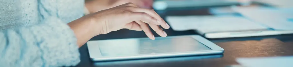 Woman with tablet in a meeting.