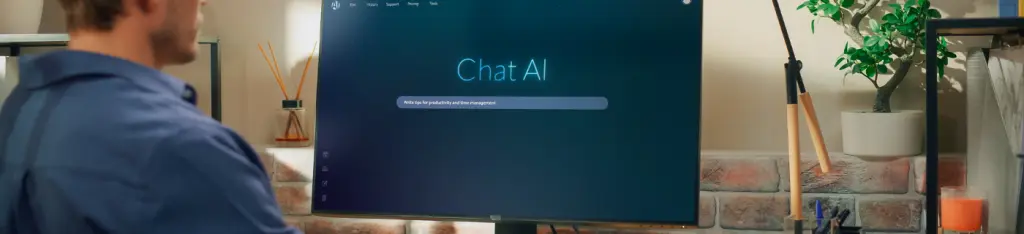 Creative Prompt Engineer Sits at a Desk Using a Computer, Using AI Chatbot Virtual Assistant. Ai-powered Tool Enhances Task Management and Boosts Efficiency Through Intelligent Productivity Assistance