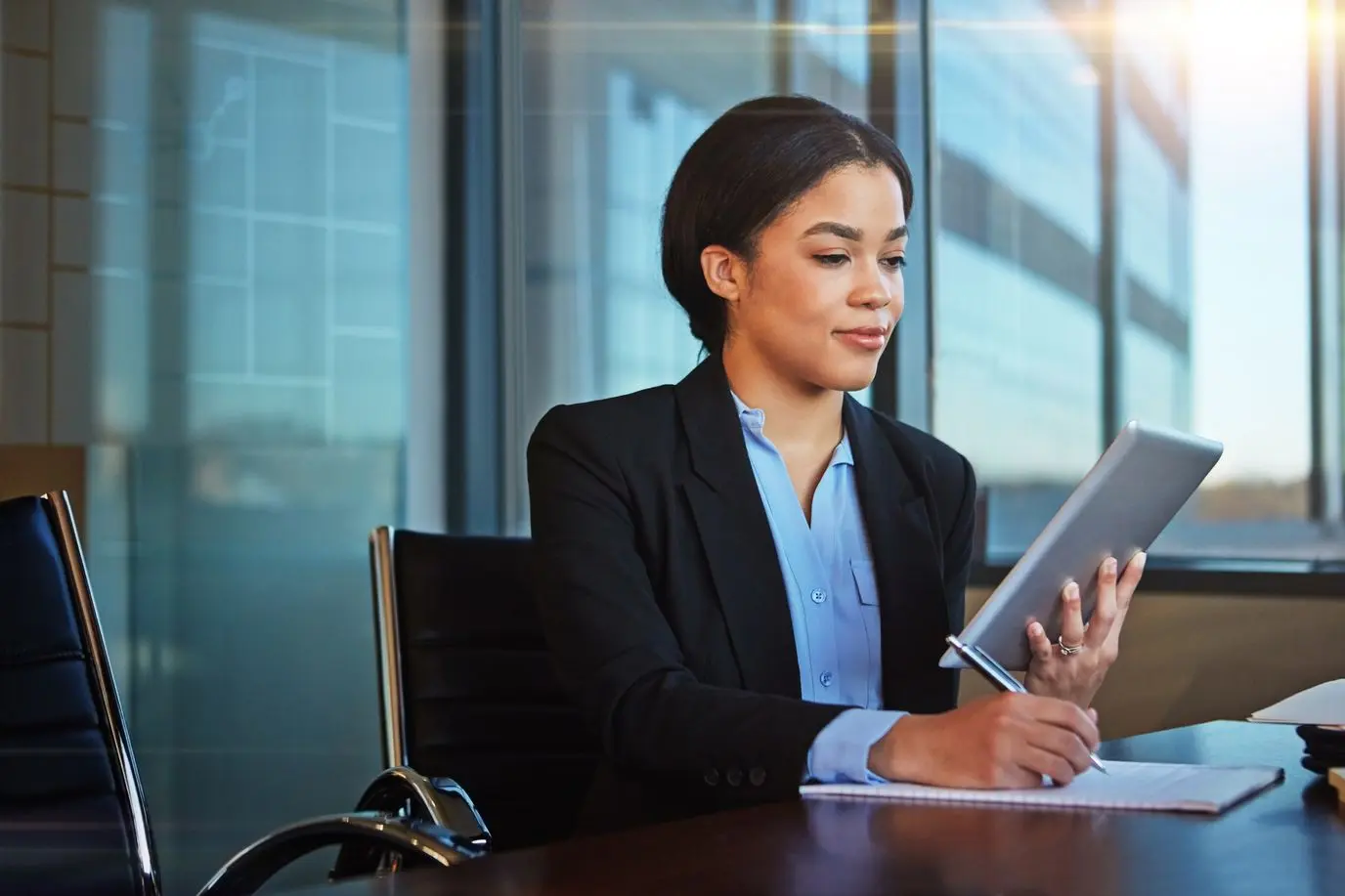 Continuous learning is the minimum requirement for success shot of a businesswoman taking notes while using her tablet