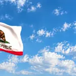 California Flag Billowing Under Blue Skies