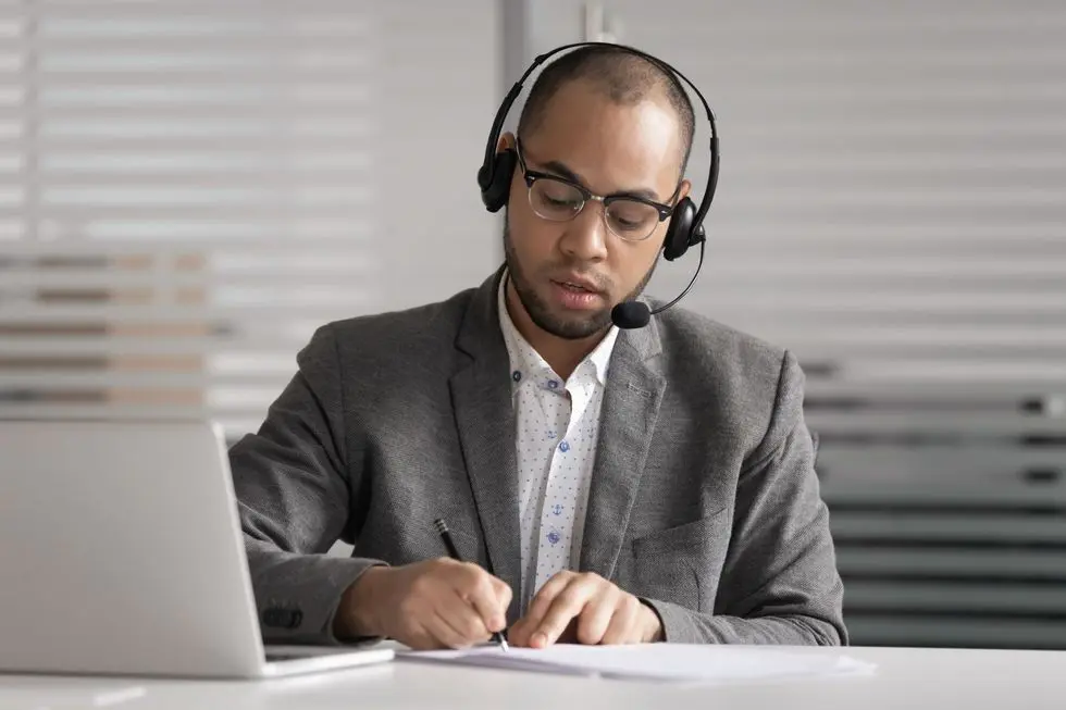 customer support service agent taking notes customer support service agent taking notes