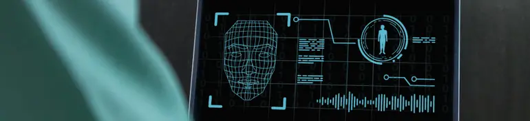 Deepfake and artificial intelligence concept. Man using a laptop to create convincing fake image, video and audio recording. - stock photo