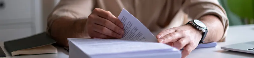 Man sorting through AI generated deposition transcript summaries