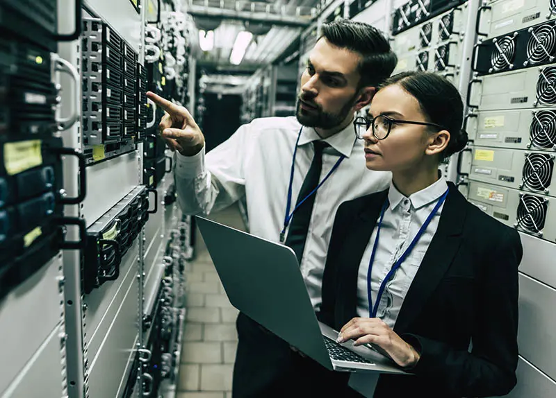 man and woman working in data centre
