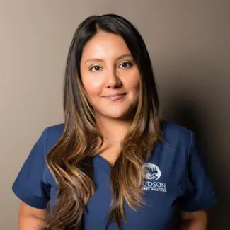 Professional portrait of Office Manager Wendy Garcia wearing a Hudson Animal Hospital scrub top in New York, NY.