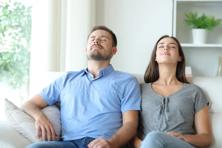 couple taking a deep breath