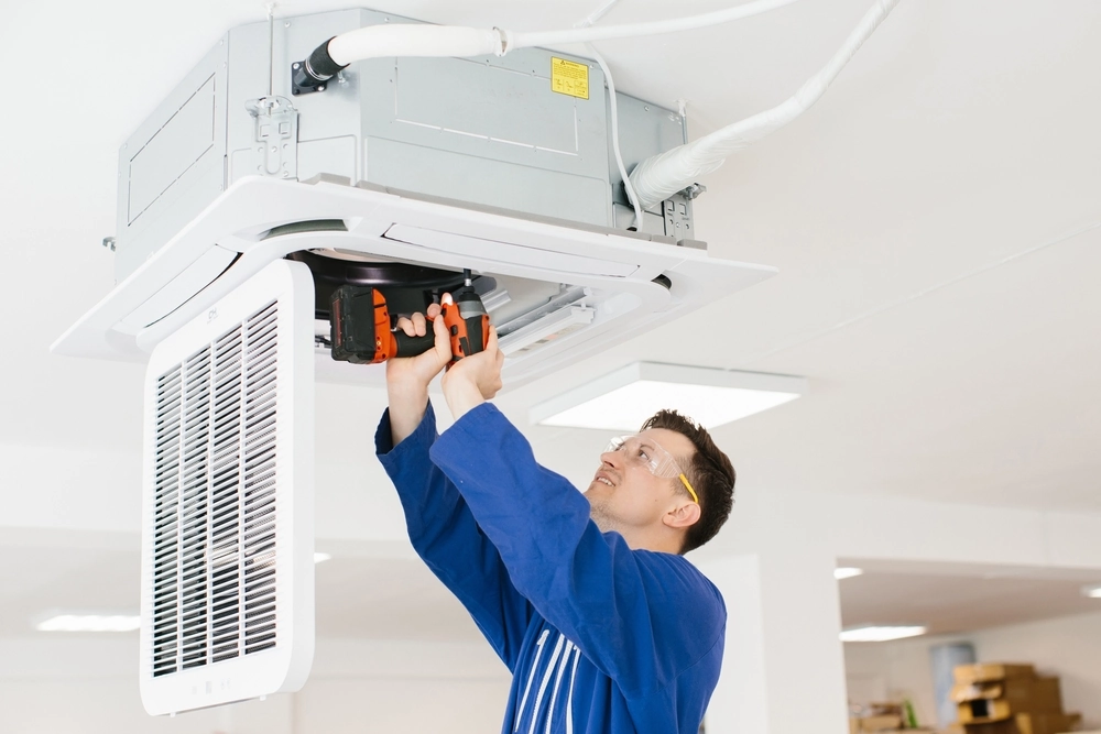 hvac worker inspecting unit