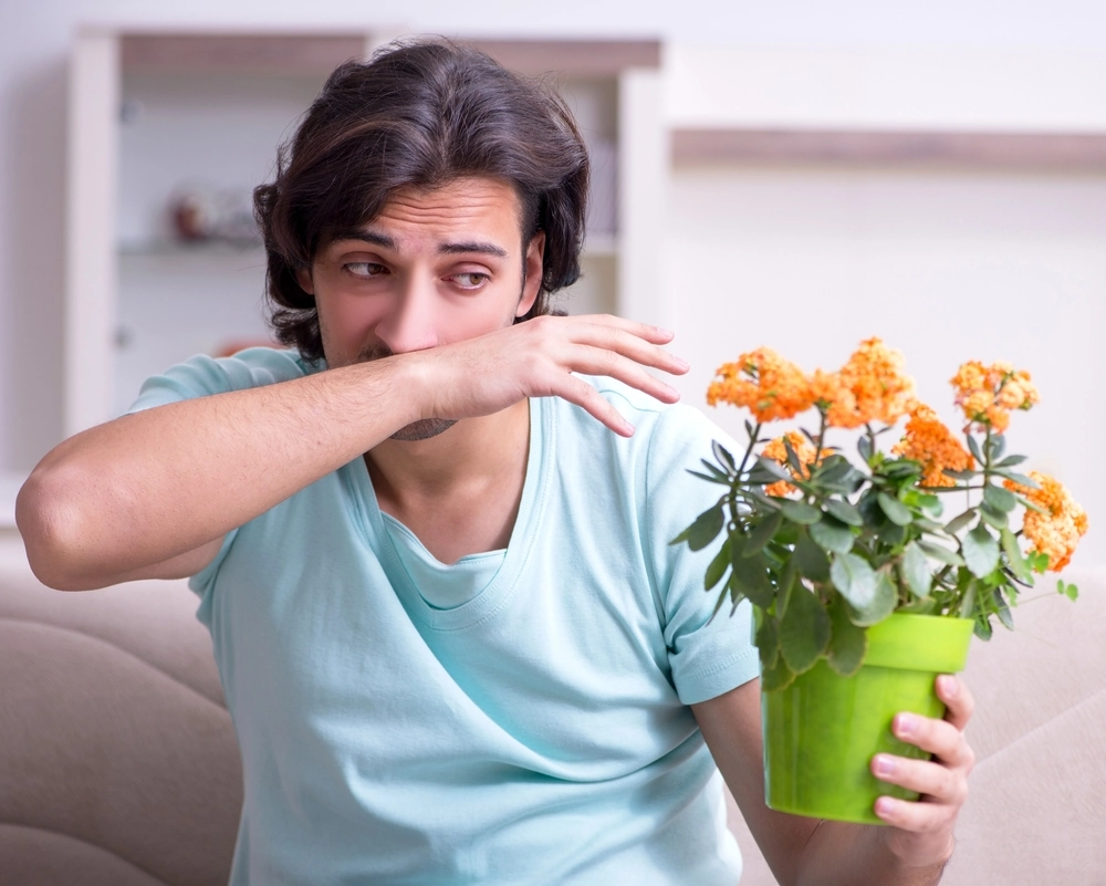 man suffering from pollen allergies