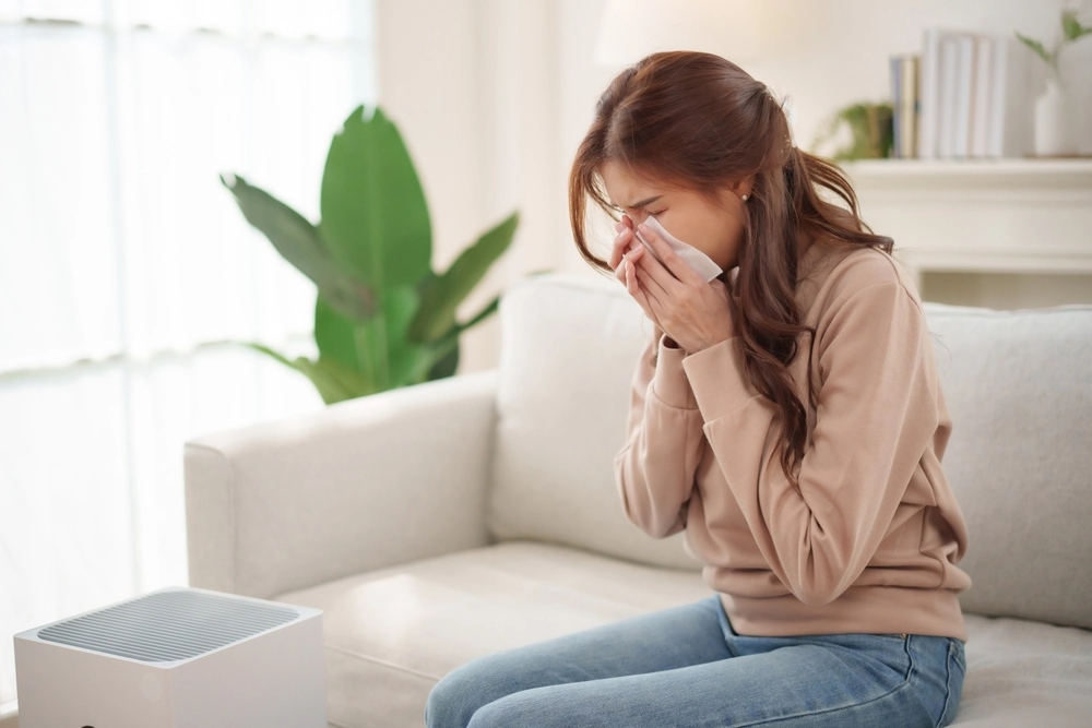 woman sneezing