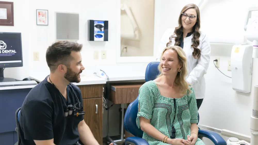 Dr. Jaden Danos consulting with patient alongside hygienist Halie at Danos Dental in Murfreesboro, TN