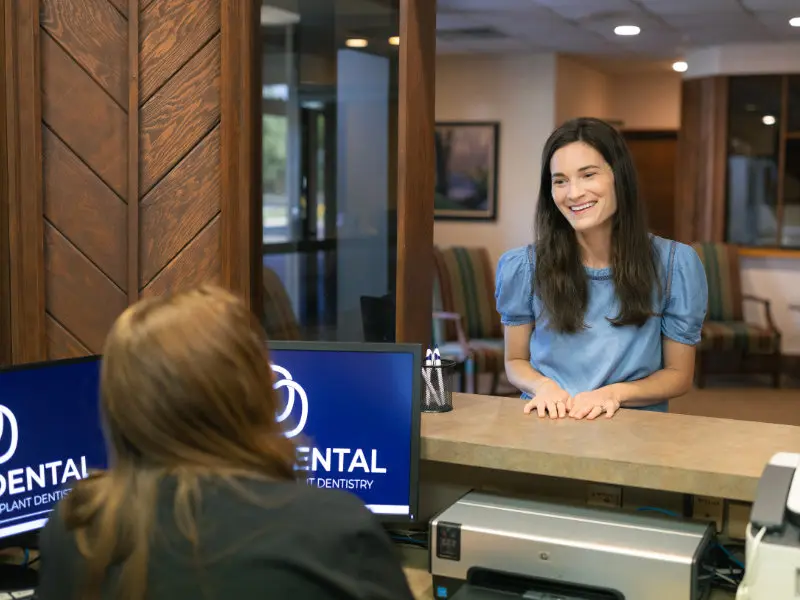 Front desk team welcoming patient at Danos Dental in Murfreesboro, TN