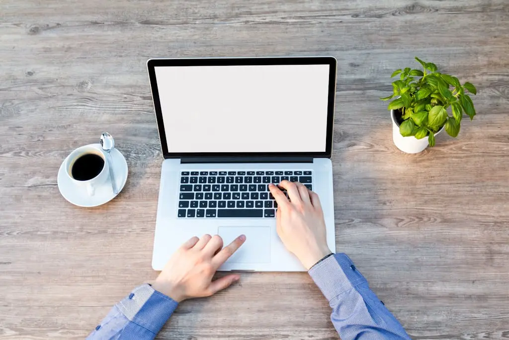 Person's Hand on Laptop