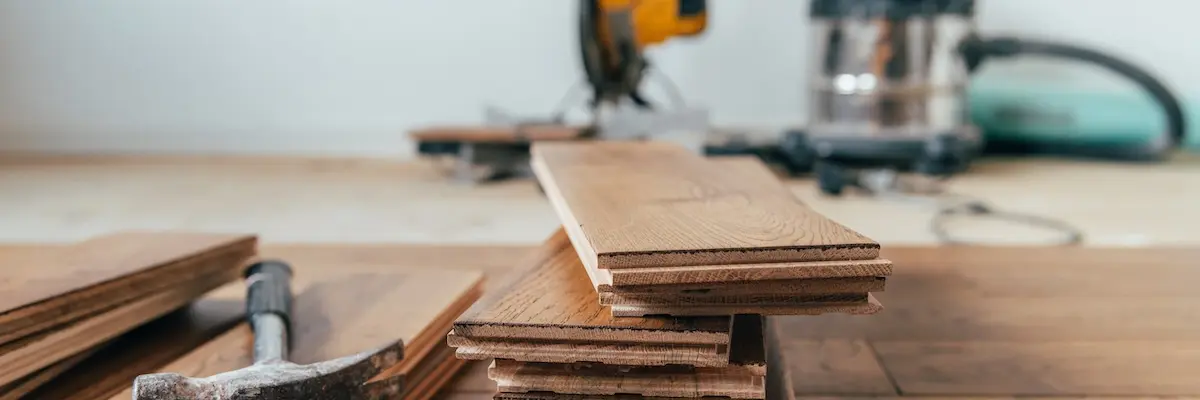 The process of house renovation with changing of the floor from carpets to solid oak wood.