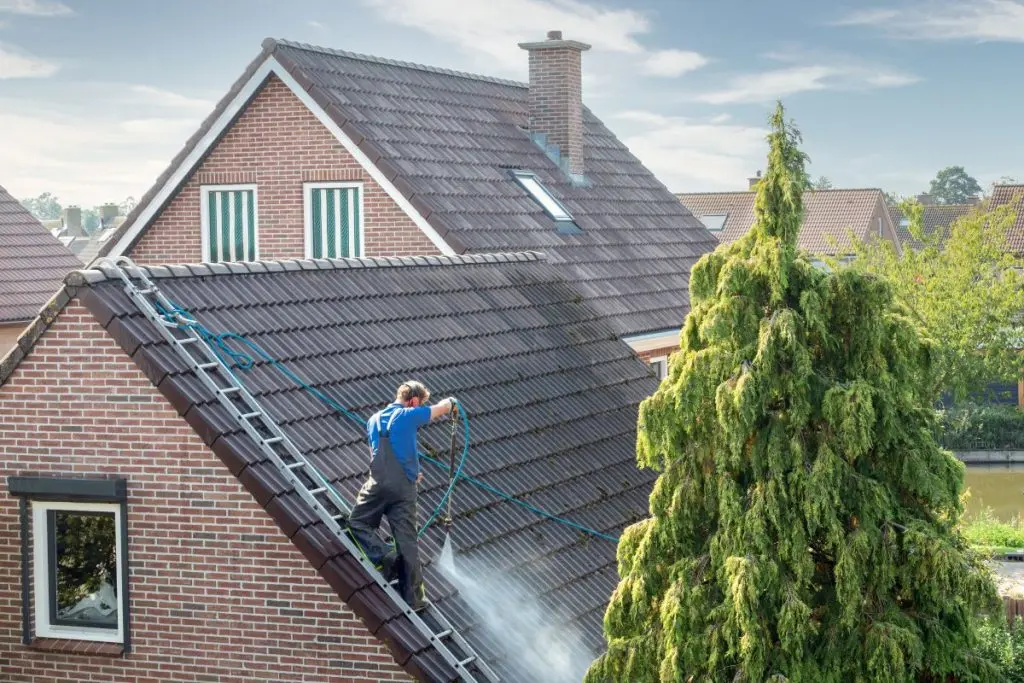 guy using pressure cleaning 