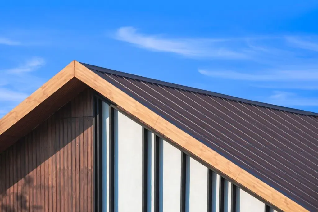 hip roof vs gable roof front long windows blue sky