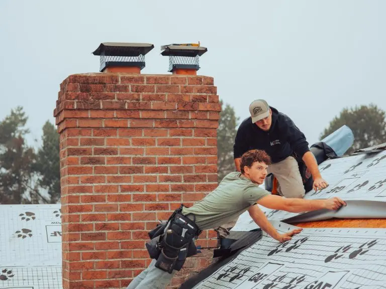 worker replacing metallic roof