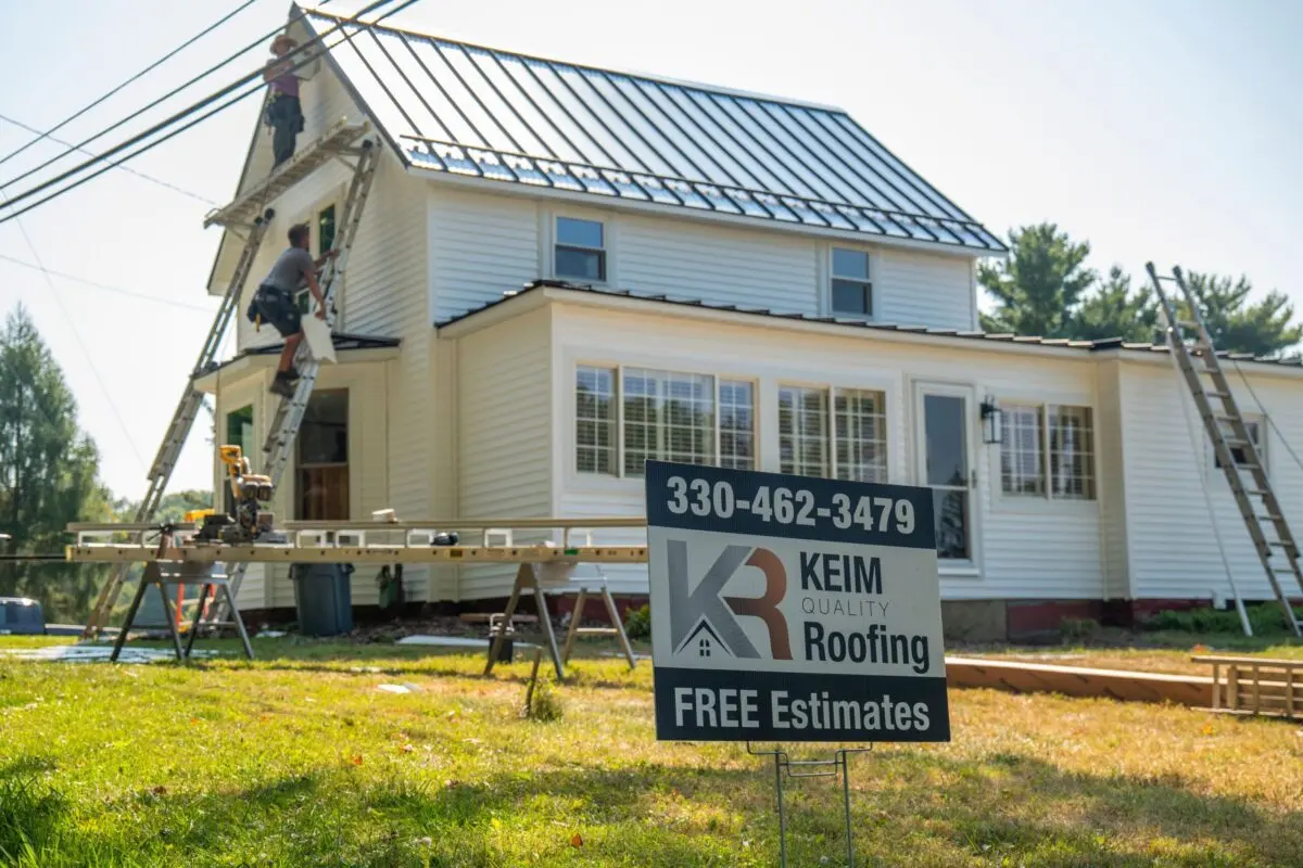 gaf timbersteel workers installing new metallic roof