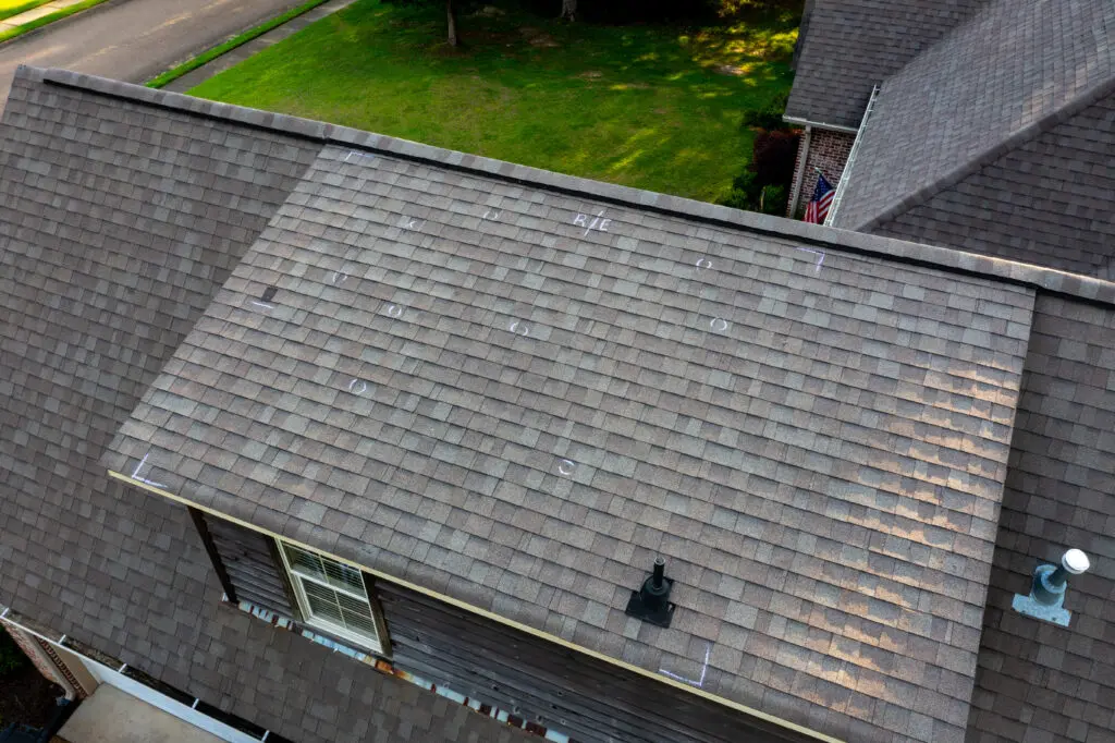 what does hail damage look like on a roof Roof with hail damage and chalk markings from inspection