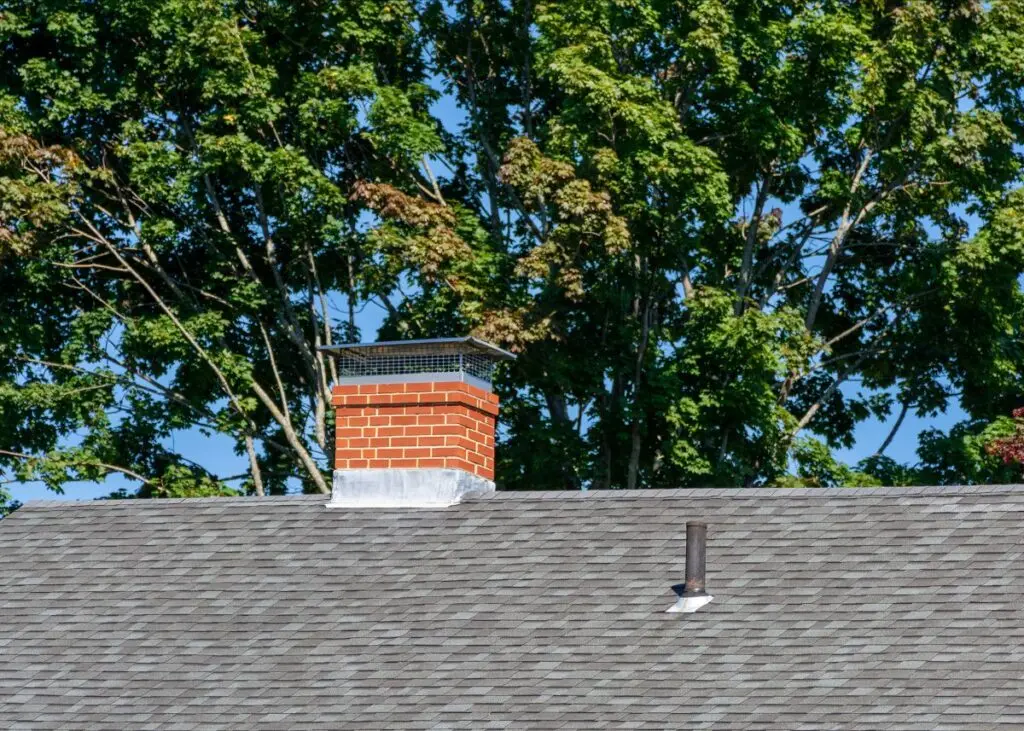 roof flashing asphalt tiles brick walled chimney