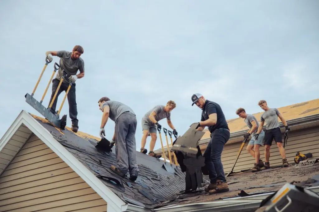 roofing insurance Keim quality Roofing workers on top of roof
