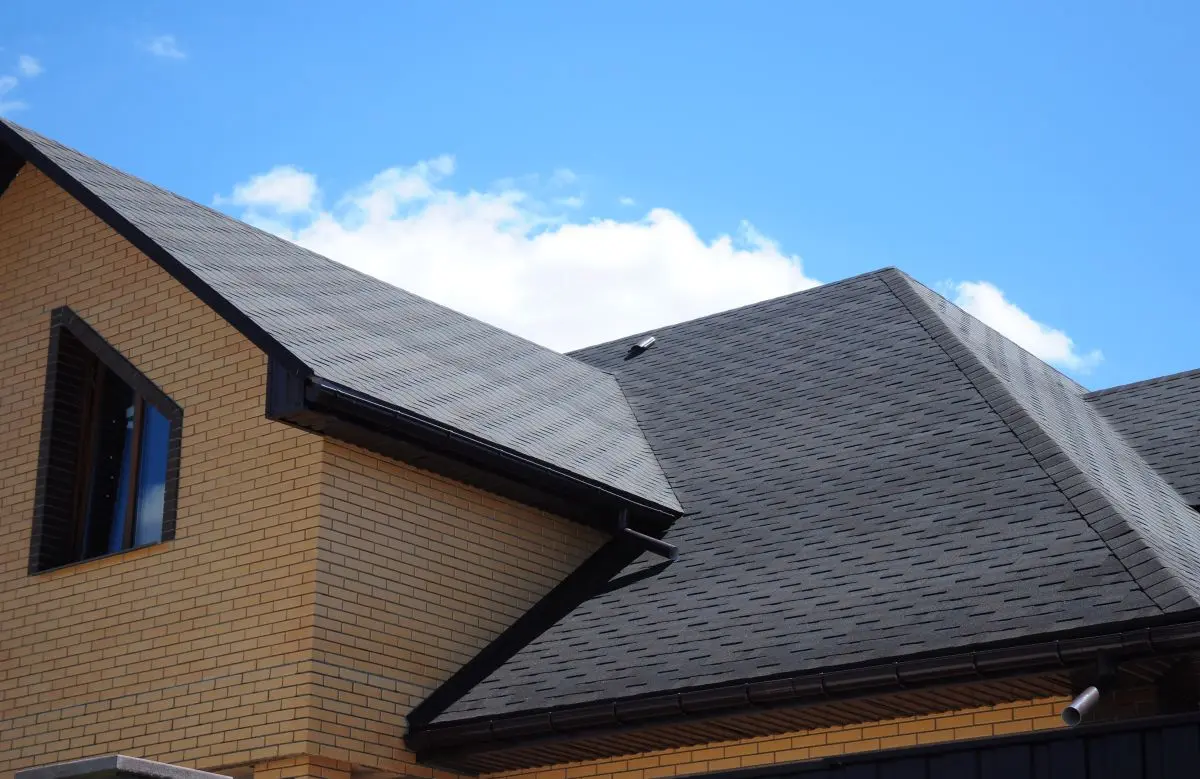 brick house with asphalt shingle roof