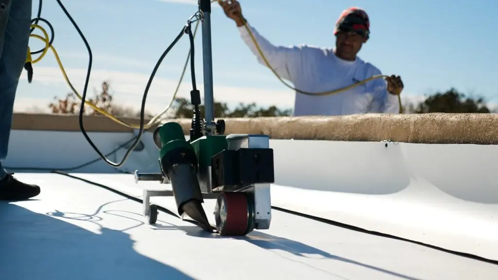 guy installing TPO roof