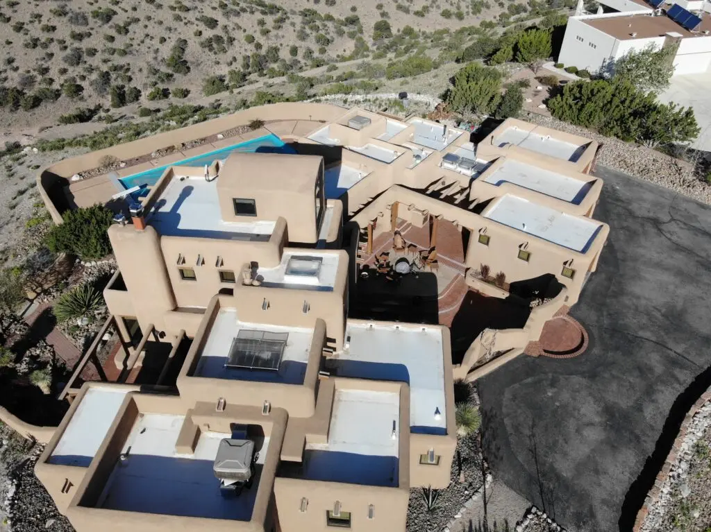The flat, tiered roof structure highlights the need for experienced and reliable maintenance from the best roofing companies in Albuquerque.