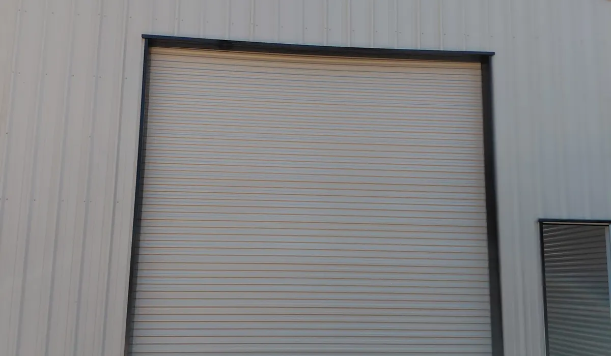 Large roll-up door on a metal shop building