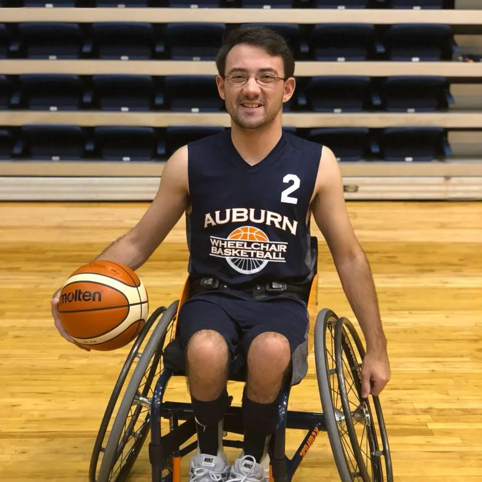 Dudley Luckie poses in his Auburn wheelchair basketball uniform