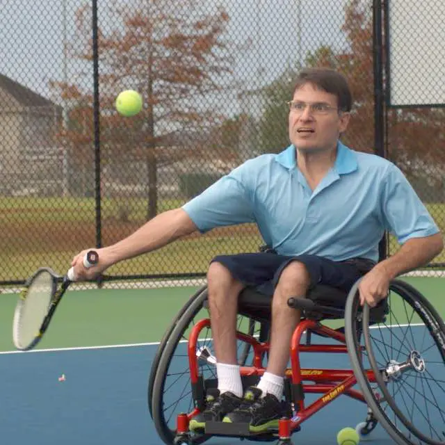Philip Meadows plays tennis