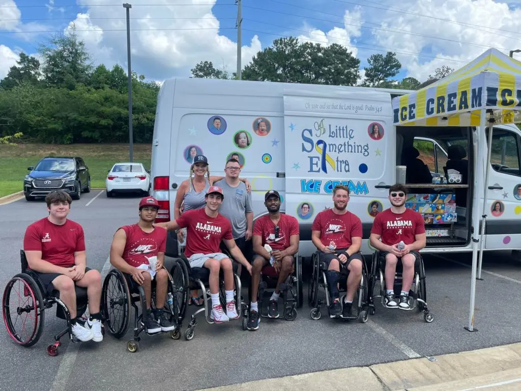 Members of the Alabama wheelchair basketball team pose for a photo