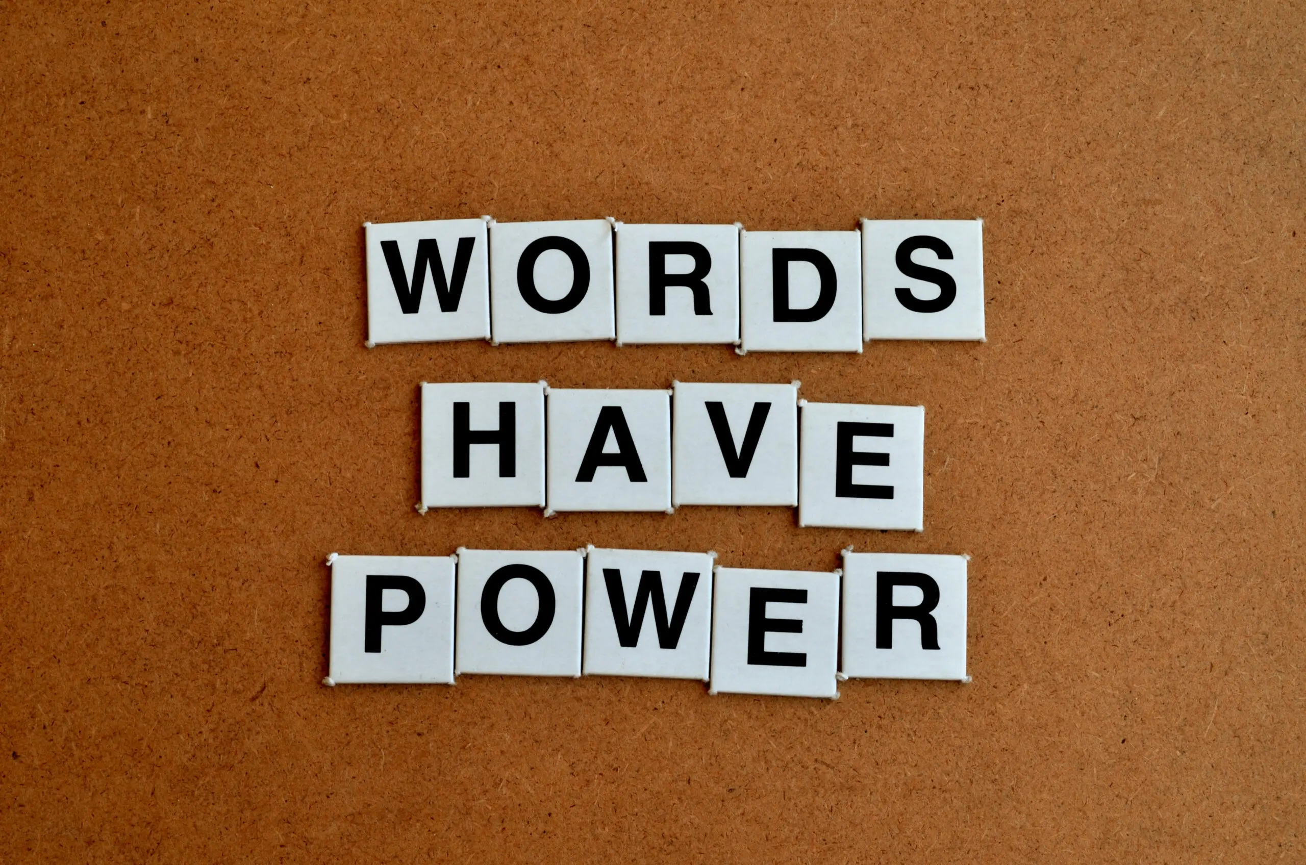 "Words have power" spelled out with letter tiles