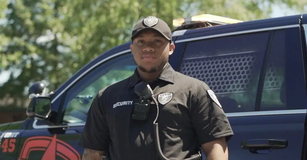 silbar security officer standing in front of car