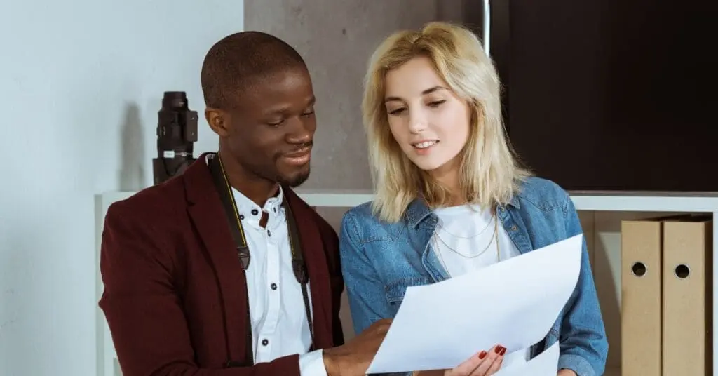 two people viewing a portfolio