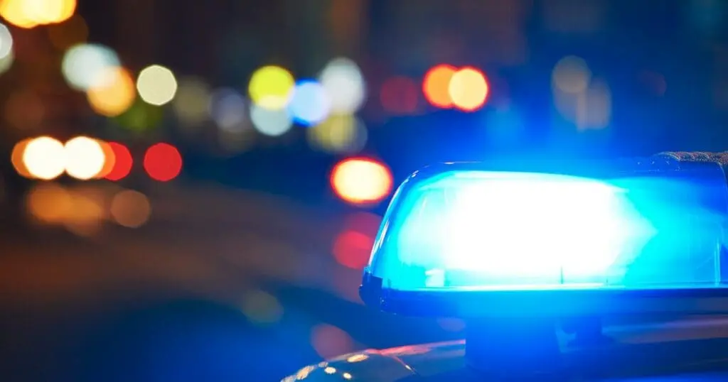 top of a patrol car with the siren on