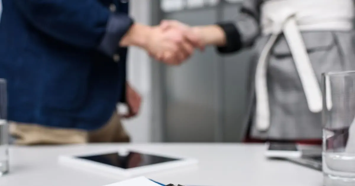 two people shaking hands