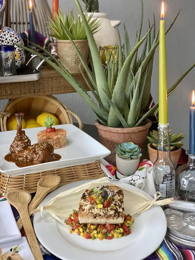 Handheld Catering Mexican-themed taco bar table setup with decorations