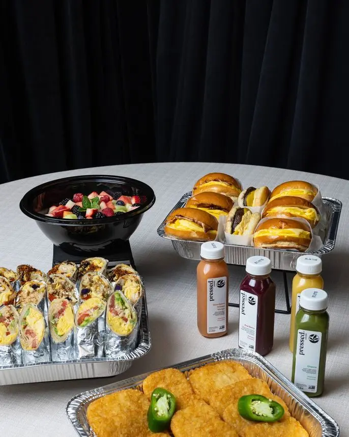 Handheld Catering express catering spread with sandwiches and sides in tin pans