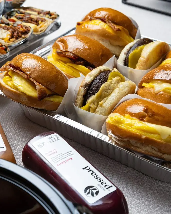 Assorted brioche egg sandwiches ready for last-minute delivery by Handheld Express