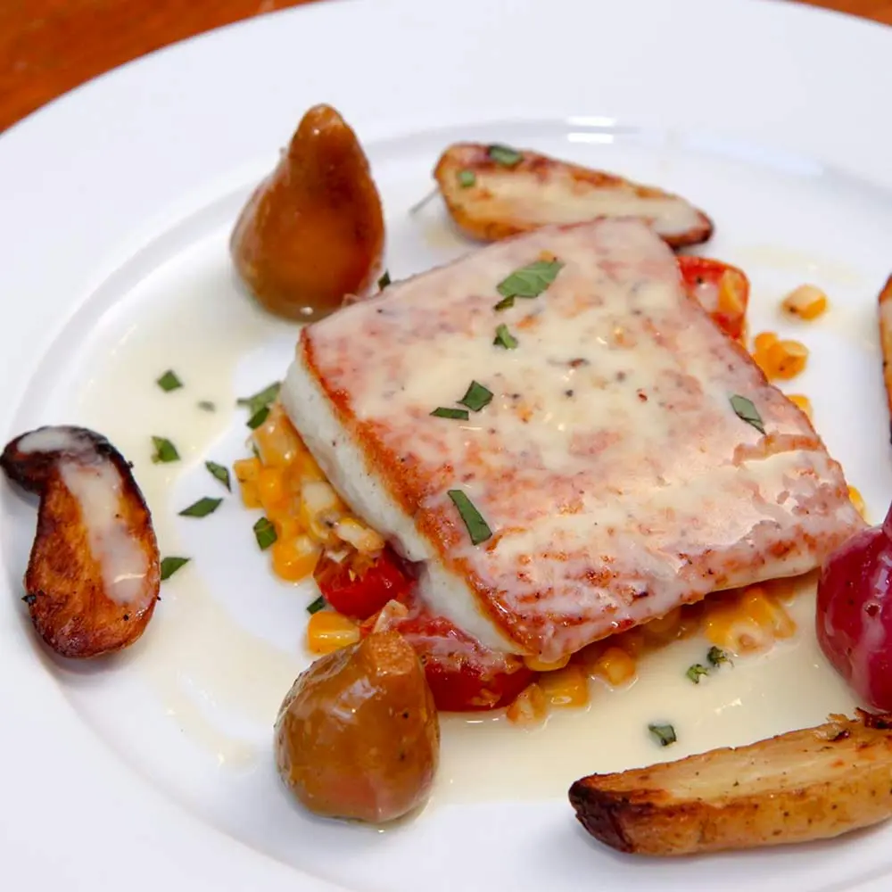 Plated seared fish with roasted potatoes and vegetables, Handheld Catering plated dinner