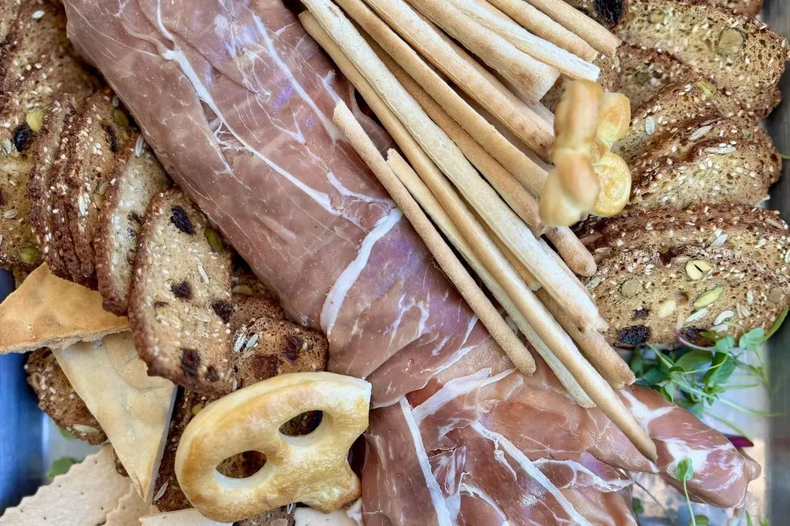 Handheld Catering Spooky Season grazing board with a monster hand centerpiece