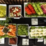 Fresh locally sourced vegetables, greens and smoked salmon on a Handheld Catering buffet, a Certified California Green Business since 2018