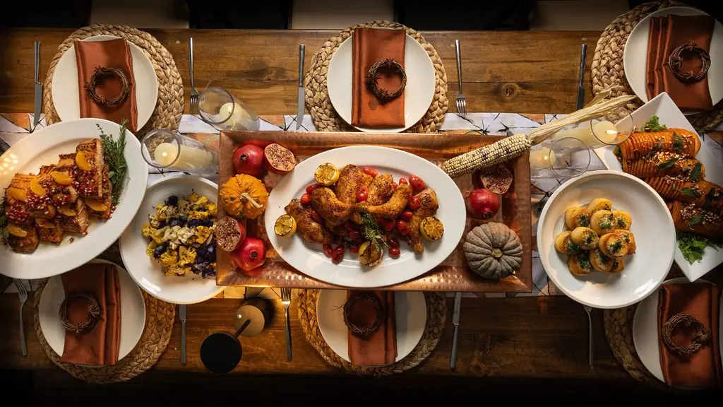 Handheld Catering fall harvest table set family style with seasonal produce