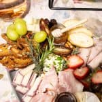 Handheld Catering farm-to-fork seasonal grazing board with artisan cheeses, fresh fruit and rose wine — Silicon Valley catering
