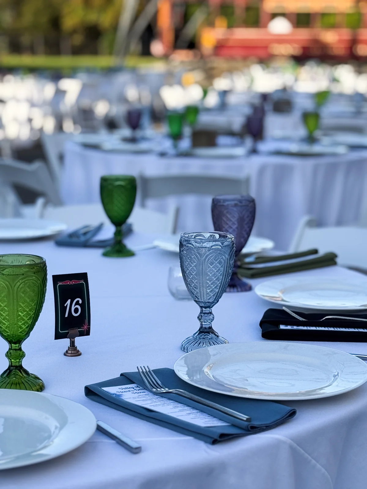 Handheld Catering servers delivering family-style platters to guests at History Park San Jose gala