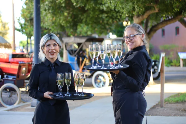 Handheld Catering team setting up tables for the History Park San Jose fundraising gala