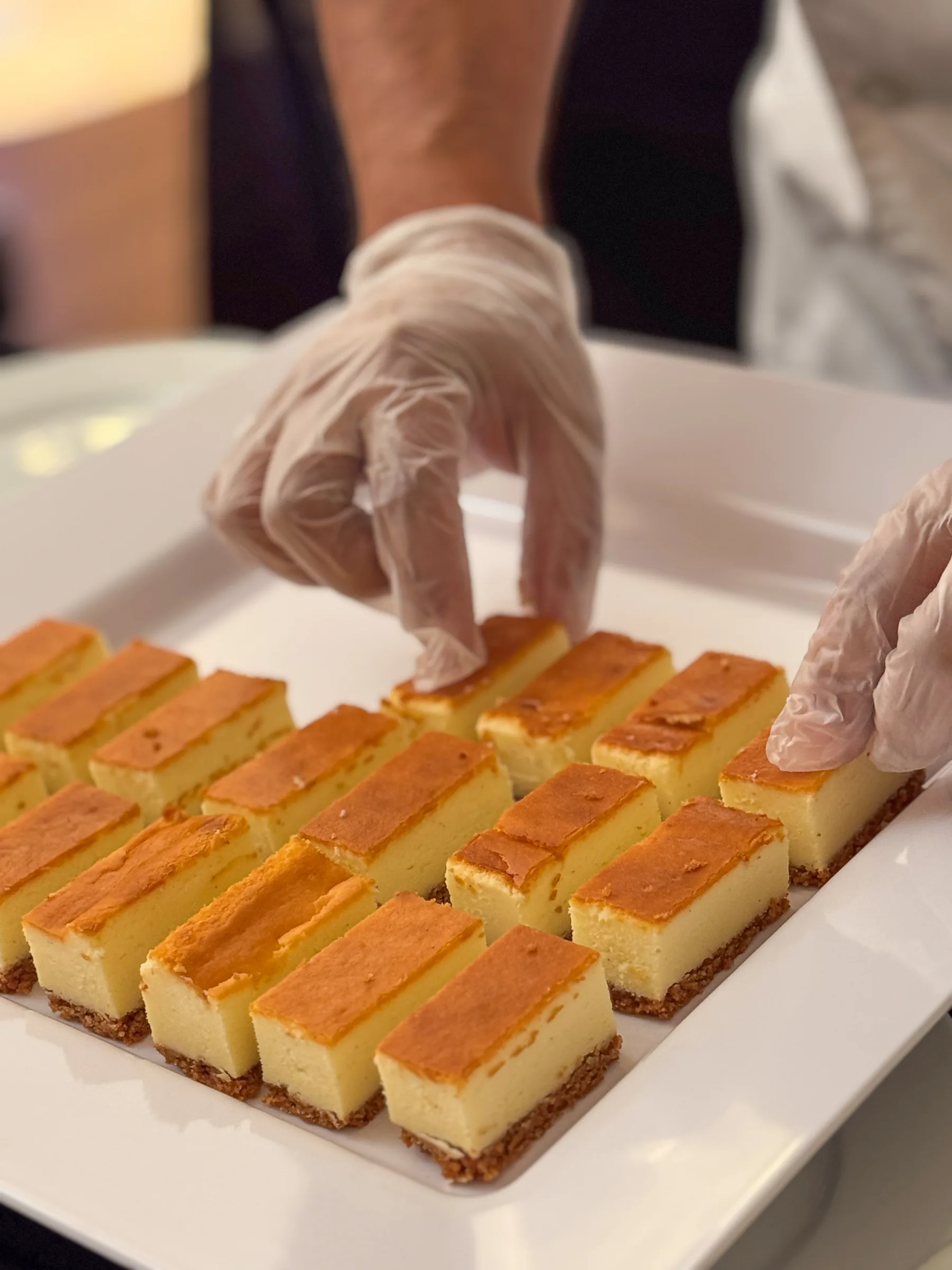 Homestyle Basque cheesecake bars plated by Handheld Catering for the History Park San Jose fundraising gala