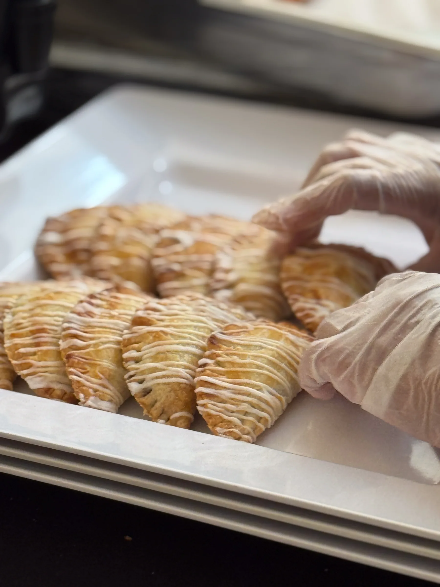 Mini berry hand pies with icing drizzle prepared by Handheld Catering for the History Park San Jose fundraising gala
