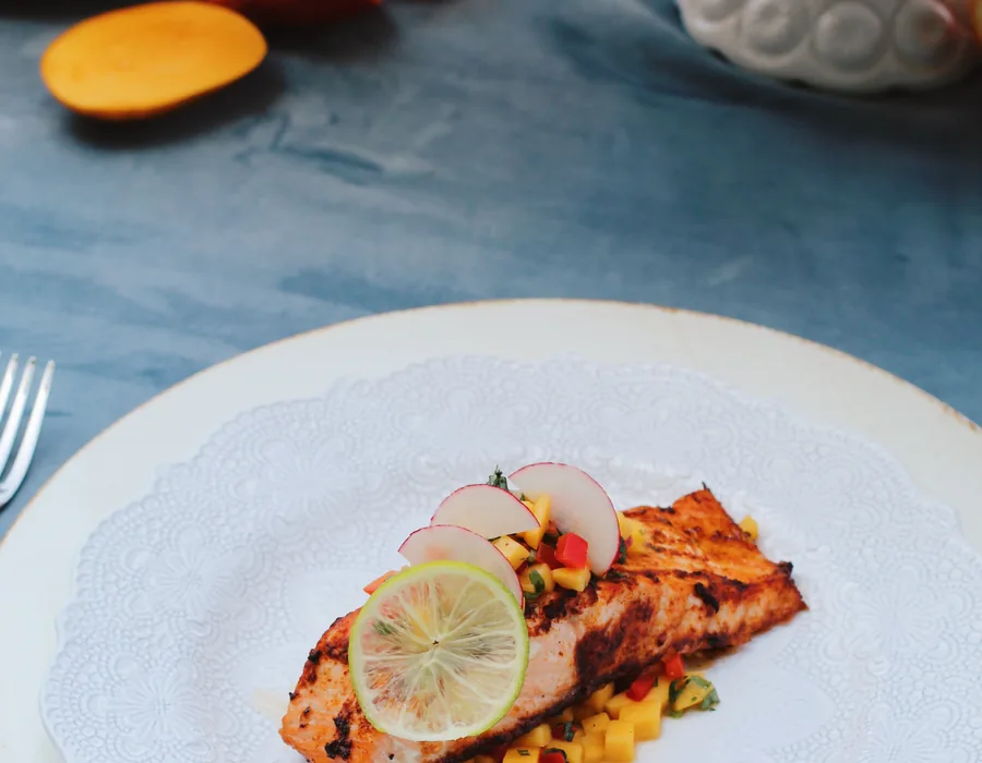 Plated chile lime salmon with Caribbean salsa at a Handheld Catering wedding tasting in Silicon Valley